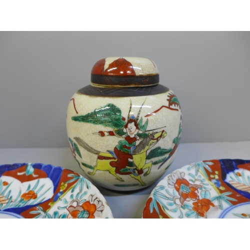 700 - Two Imari plates and a ginger jar