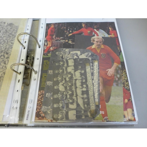 703 - A folder containing classic rock colour photographs (6), including Ozzy Osborne and football scrap f... 