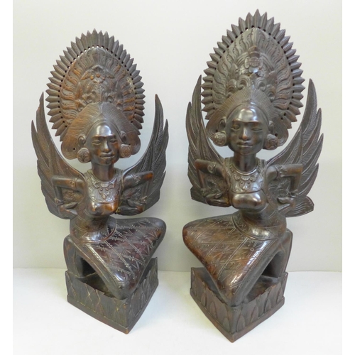 726 - A pair of carved wooden Balinese figures