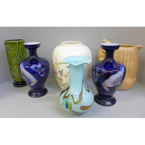 740 - A Poole Pottery vase, a Sylvac squirrel jug, hairline crack to rim, a Sylvac celery vase, blue glass... 