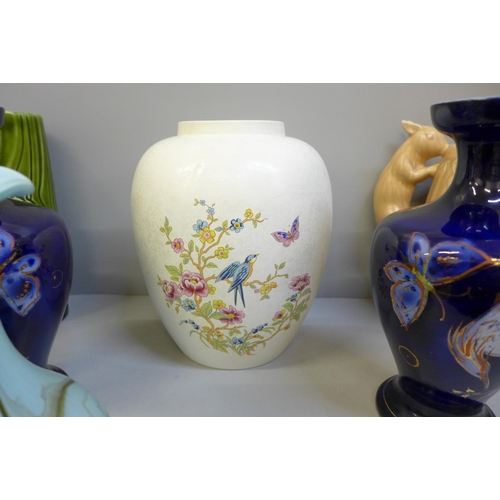 740 - A Poole Pottery vase, a Sylvac squirrel jug, hairline crack to rim, a Sylvac celery vase, blue glass... 