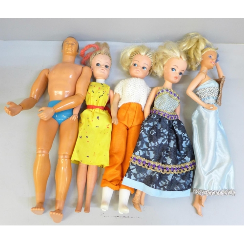 744 - A box of Sindy dolls and clothes, an Action Man and a Barbie doll