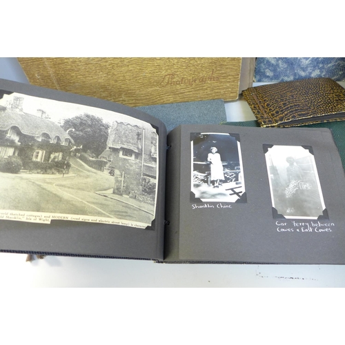 752 - A collection of photographs including an album with early 1950s London photographs and a collection ... 