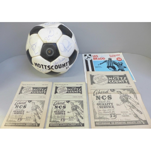 760 - Football memorabilia; a Notts County signed football from Les Bradd Testimonial and accompanying pro... 