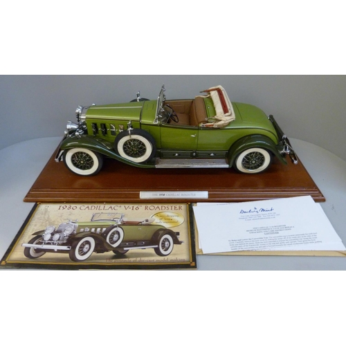 791 - A Danbury Mint 1:12 scale 1930 Cadillac V-16 Roadster on a wooden plinth, with brochure and certific... 