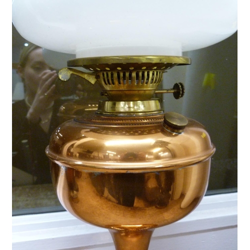 809 - An oil lamp with copper base