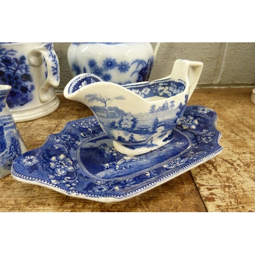 821 - Blue and white china; Death of Punch dish, a loving mug and three jugs