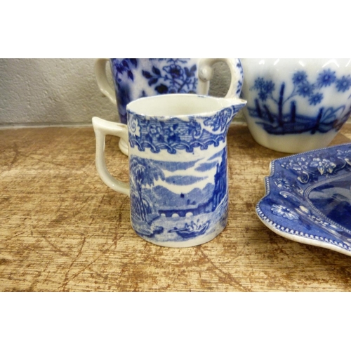 821 - Blue and white china; Death of Punch dish, a loving mug and three jugs