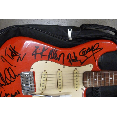 827 - A signed Rockwood by Hohner guitar by Def Leppard including Joe Elliott, Rick Allen and Rick Savage