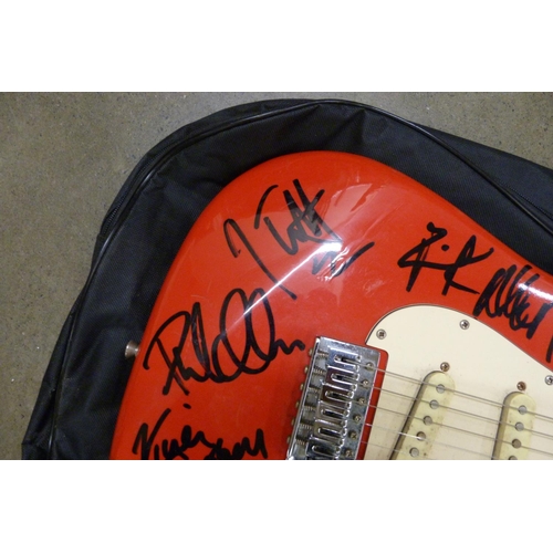 827 - A signed Rockwood by Hohner guitar by Def Leppard including Joe Elliott, Rick Allen and Rick Savage