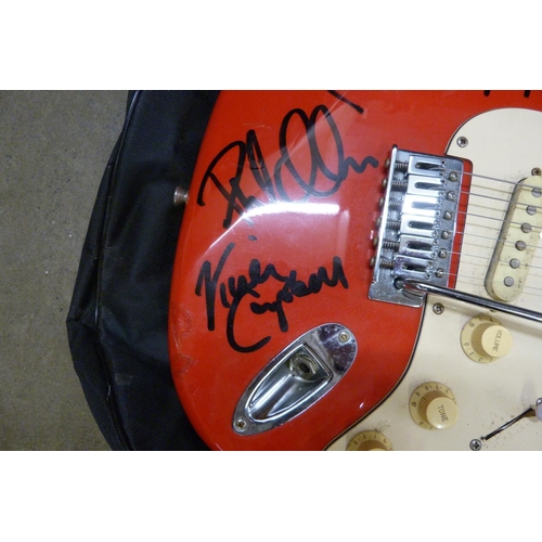 827 - A signed Rockwood by Hohner guitar by Def Leppard including Joe Elliott, Rick Allen and Rick Savage