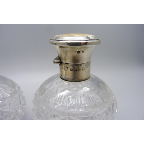 855 - A pair of silver and enamel cut glass scent bottles, Birmingham 1934, enamel a/f on one