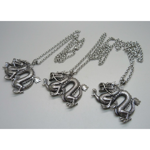 859 - Three large dragon pendants on chains