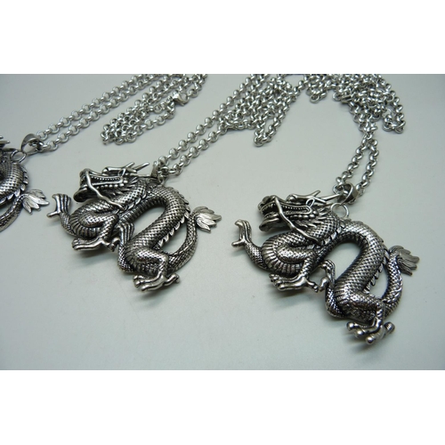 859 - Three large dragon pendants on chains