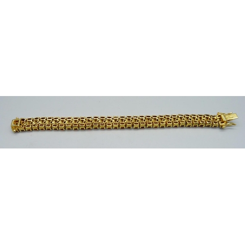 866 - A silver gilt, three row garnet bracelet