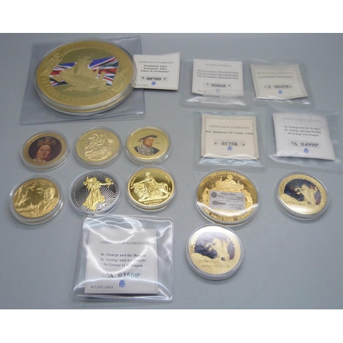 878 - A collection of gold plated coins including Kings and Queens, Winston Churchill, St. George and The ... 