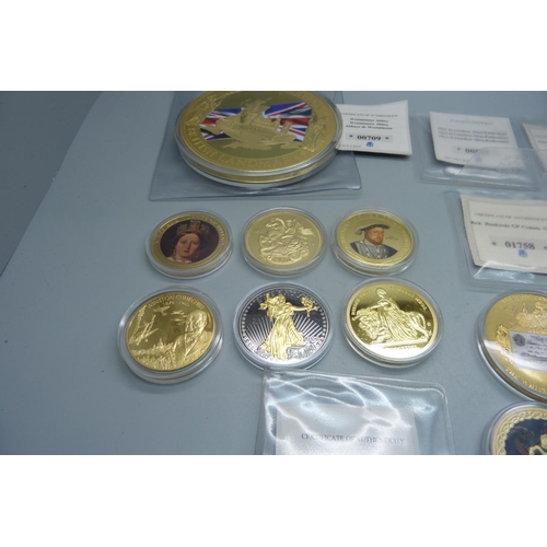 878 - A collection of gold plated coins including Kings and Queens, Winston Churchill, St. George and The ... 