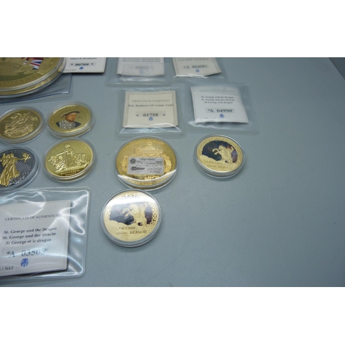 878 - A collection of gold plated coins including Kings and Queens, Winston Churchill, St. George and The ... 