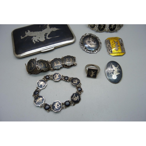 881 - A collection of Siam silver and niello jewellery and a cigarette case, total weight 253g, one bracel... 