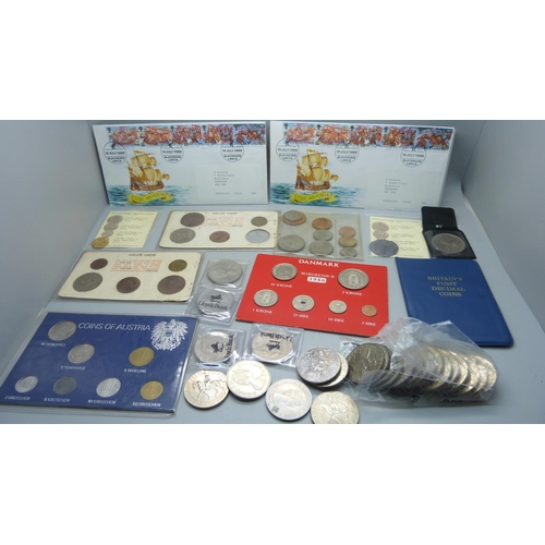 893 - A collection of coins and coin sets including two reproduction Armada coins, crowns, etc.