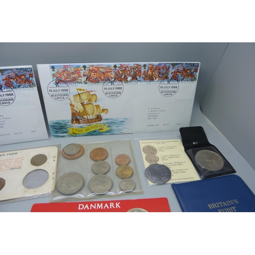 893 - A collection of coins and coin sets including two reproduction Armada coins, crowns, etc.