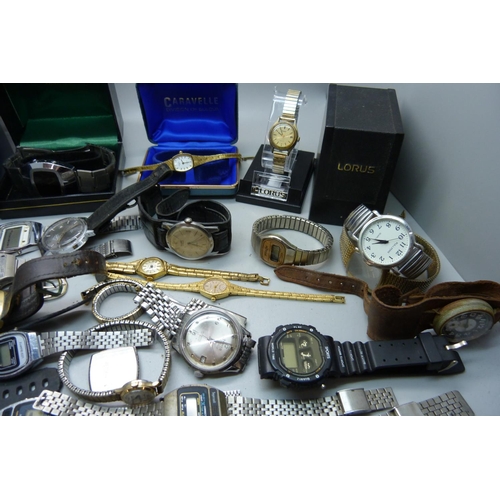 905 - A collection of lady's and gentleman's wristwatches, LCD, quartz and manual wind, also cases and bra... 