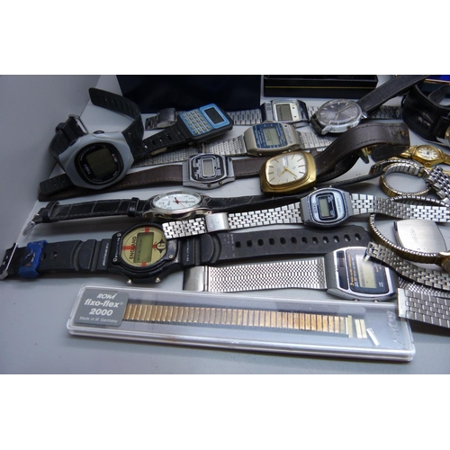 905 - A collection of lady's and gentleman's wristwatches, LCD, quartz and manual wind, also cases and bra... 