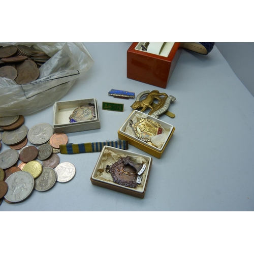 912 - British and foreign coins, two silver and other dancing medals and badges, a Leicestershire Regiment... 