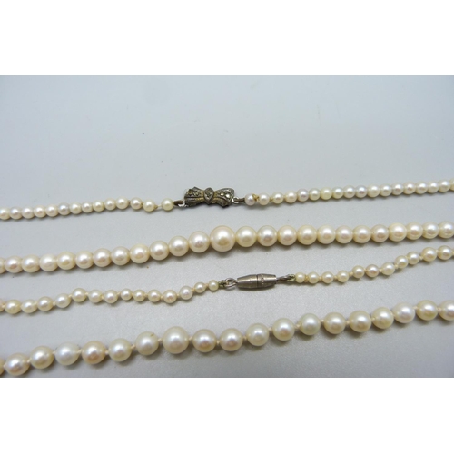 926 - Two cultured pearl necklaces, one with a silver clasp