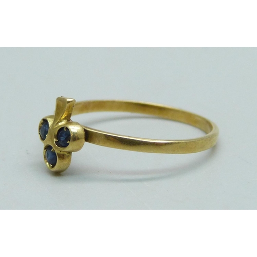 930 - A yellow metal and sapphire ring, 1.2g, K, tests as 18ct gold