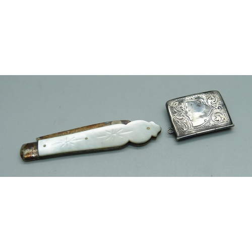 955 - A Victorian silver bladed fruit knife with mother of pearl handle and a sterling silver stamp case