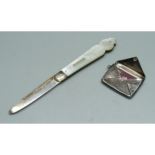 955 - A Victorian silver bladed fruit knife with mother of pearl handle and a sterling silver stamp case