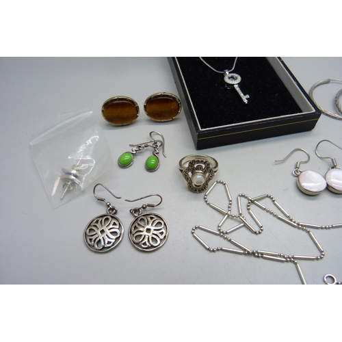 957 - Five pairs of silver earrings, three silver rings, two silver chains, one chain marked 10KGP, two pe... 