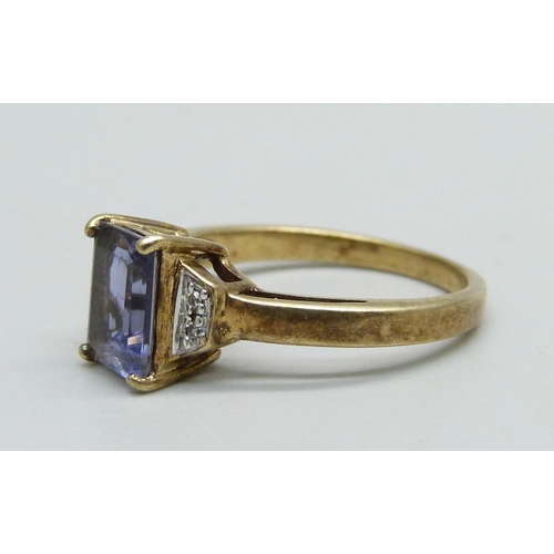 961 - A 9ct gold, diamond and blue stone ring, 2.8g, N