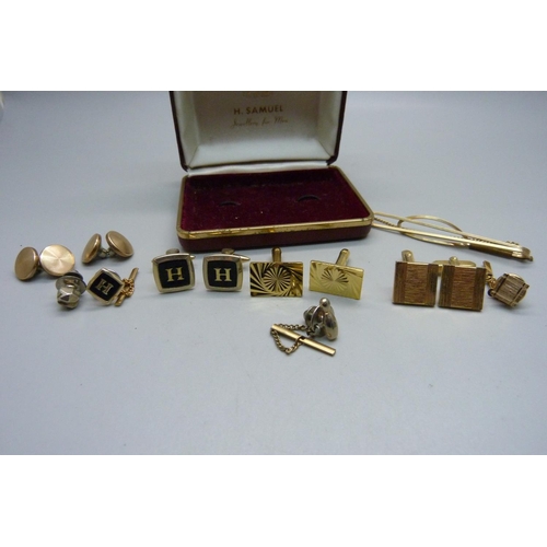 964 - A small collection of tie-pins, cufflinks and lapel studs