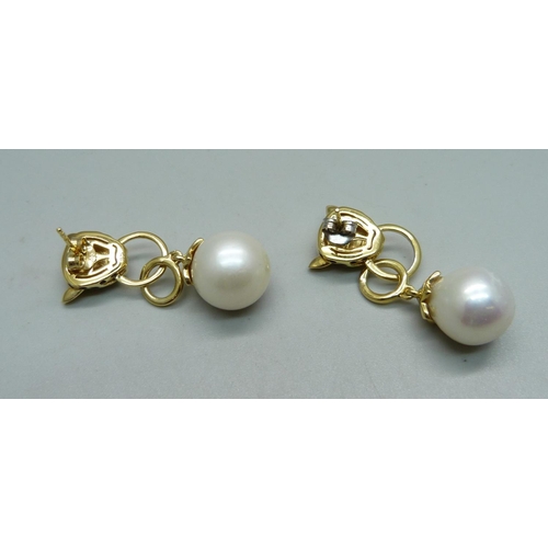 965 - A pair of silver gilt and pearl panther earrings