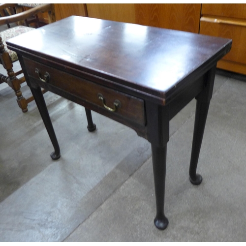 104 - A George II mahogany single drawer rectangular fold over tea table