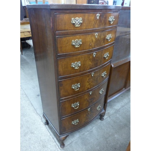 107 - A George I style flame figured mahogany bow front chest of drawers