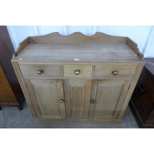 113 - A Victorian style ash and beech kitchen dresser