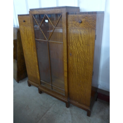 114 - An Art Deco walnut three door side cabinet