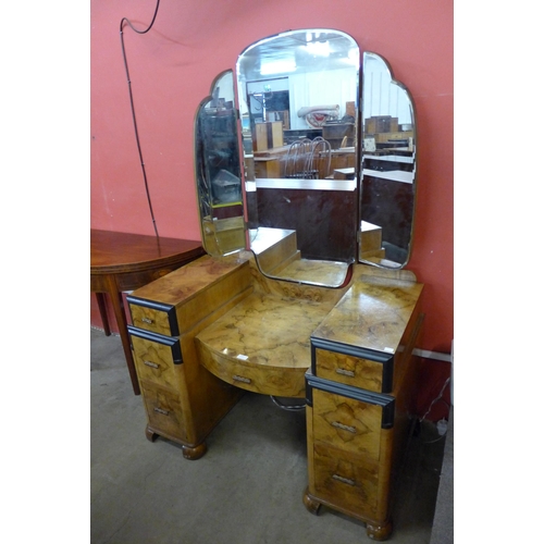 115 - An Art Deco figured walnut and ebonised dressing table