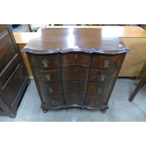 119 - A Queen Anne style mahogany and figured walnut chest of drawers