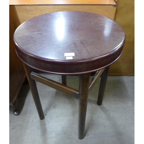 120 - An elm and Bakelite circular occasional table