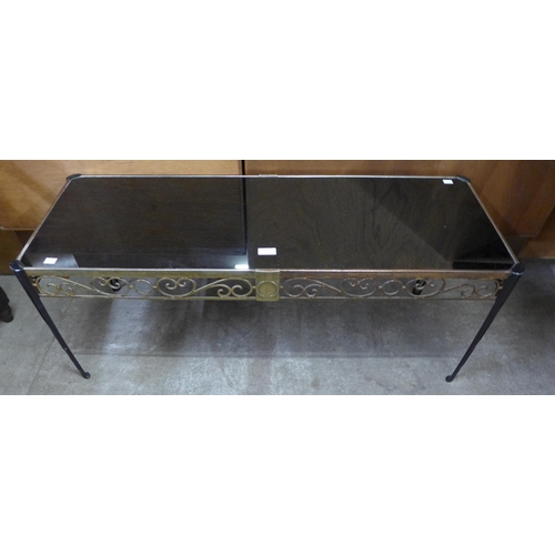 124 - An Italian style cast metal and black glass topped rectangular coffee table, reg. design no. 907897