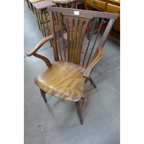 135 - An 18th Century elm and fruitwood elbow chair