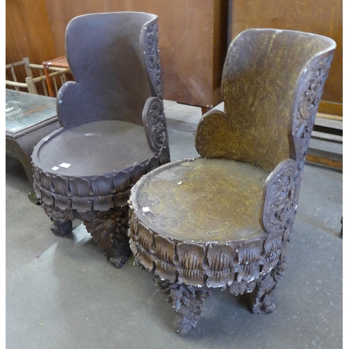 142 - A pair of Chinese carved wood chairs