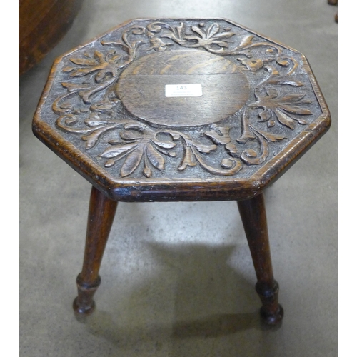 143 - A carved oak stool