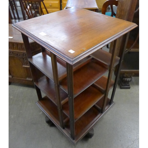 148 - An Edward VII inlaid mahogany revolving bookcase