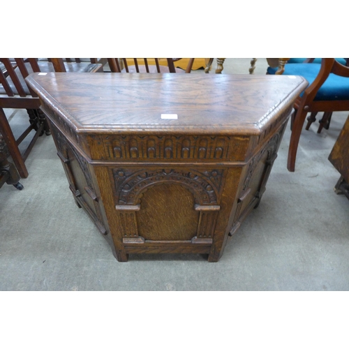 150 - A 17th Century style carved oak blanket box