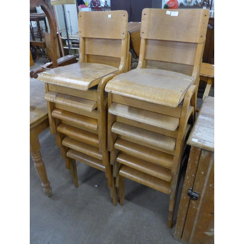 155 - A set of twelve beech and bent plywood stacking chairs